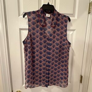 CABI sleeveless blouse subtle floral pattern.